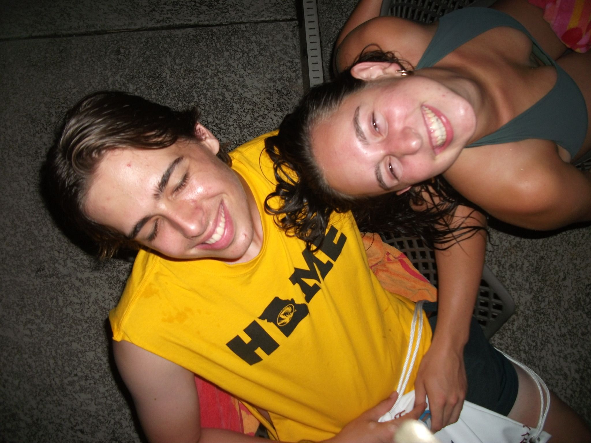 Andrew and Grace laughing with their heads together