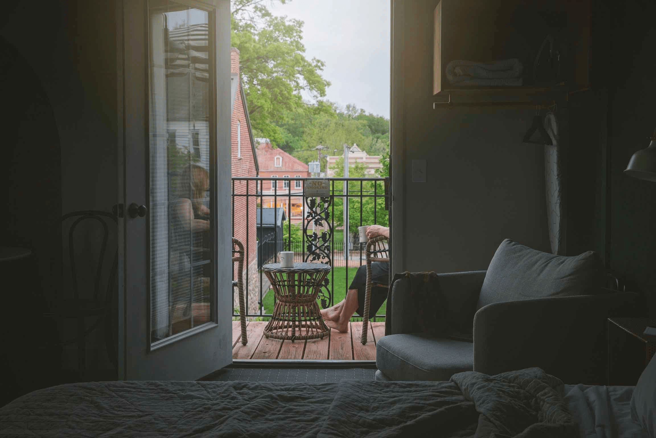 A Vinchester Inn room opening onto a small balcony over downtown Hermann